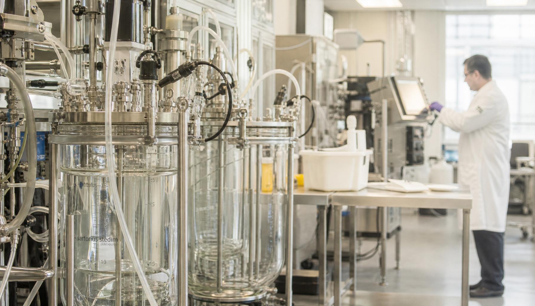 Pharmaceutical executives and scientists collaborating on strategic partnership